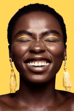 an image of a woman with yellow makeup on her face