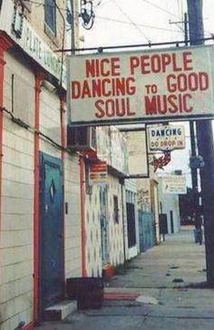 a sign that says nice people dancing to good soul music on the side of a building