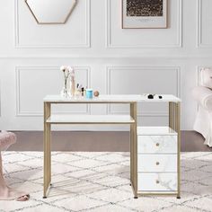 a white and gold desk with drawers in front of a mirror, chair and wall