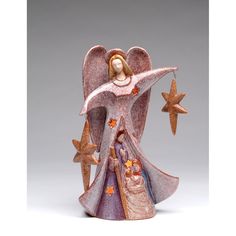 an angel figurine with stars around it