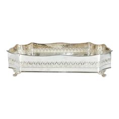 a silver tray with ornate designs on it