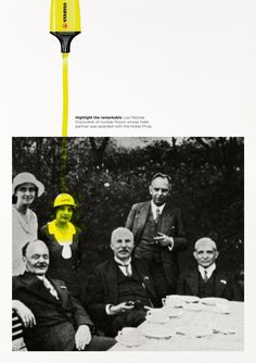 an old photo of people sitting at a table with a yellow marker in the middle