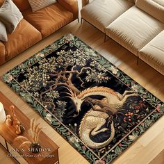 a living room area rug with a dragon and tree design on the floor in front of a couch