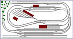 an image of a model train track with red and green tracks on each one side