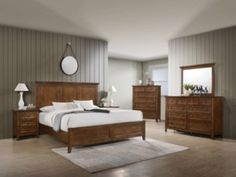 a bedroom scene with focus on the bed and dresser