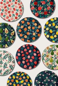 six plates with fruit designs on them in different colors and sizes, all decorated with leaves