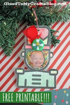 a christmas ornament hanging from a tree with the words free printables