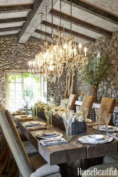 a dining room table is set with place settings