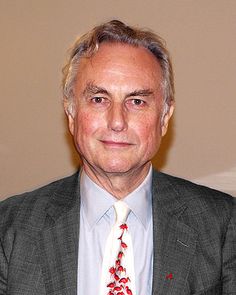 an older man wearing a suit and tie