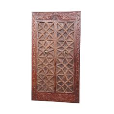 an old wooden door with intricate carvings on the front and side panels, isolated against a white background