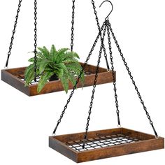 two hanging planters with plants in them