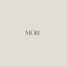 the word mor is written in black ink on a gray background with a white border