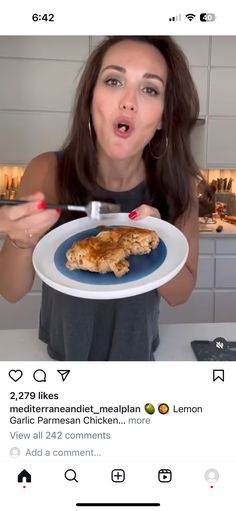 a woman holding a plate with food on it and making a funny face at the camera