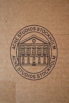 a brown cardboard box with the words acne studios stockholm on it