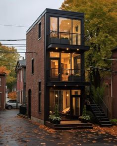 a two story house in the middle of an alleyway with stairs leading up to it