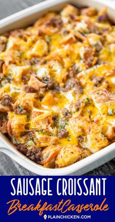 sausage croissant breakfast casserole in a white dish on a wooden table