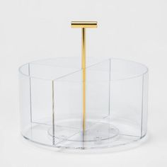 an object that is on top of a glass container with a metal pole sticking out of it