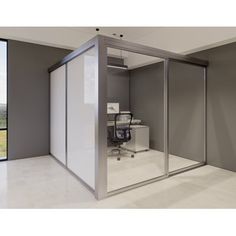 an office with a glass wall and sliding doors