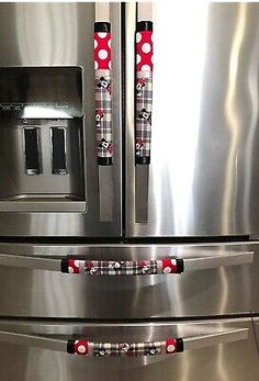 a stainless steel refrigerator with mickey mouse handles