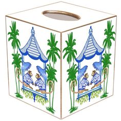 an artisticly designed tissue box with monkeys and palm trees on the outside, in blue and green