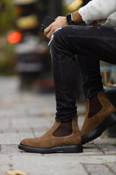 Embrace comfort and sophistication with these brown suede Chelsea boots. The soft suede and classic design make them perfect for everyday wear, while the brogue detailing adds a touch of unique style.