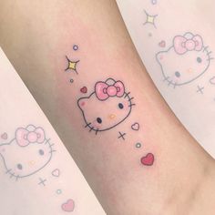 two hello kitty tattoos on both legs with hearts and stars around them, one has a pink bow