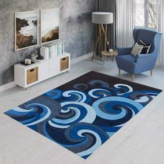 a living room with a blue chair and rug