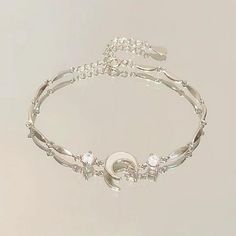 Description: Material: alloy Size:onesize Color:as picture 1. A bow symbolizes love, sweetness, and romance, while also conveying a feminine softness and elegance. 2. This bracelet features a slender chain with a cherry blossom shaped pendant embedded in the middle, which not only serves as decoration but also enhances the overall visual appeal of the bracelet. 3. Suitable for daily casual attire, it can also add a touch of warmth and romance in special occasions such as dates, parties, celebrat Feminine Softness, Butterfly Charm Bracelet, Crystal Flowers, Spring Clothing, Bow Bracelet, Moon Pendant Necklace, Pink Dresses, Pretty Bracelets, Bead Charm Bracelet