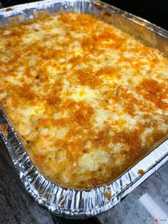 a cheesy casserole in a metal pan