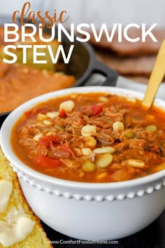 a white bowl filled with stew next to some bread on a black surface and the words classic brunswickswick stew in front of it