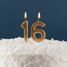 a close up of a cake with candles in the shape of number 16 on it