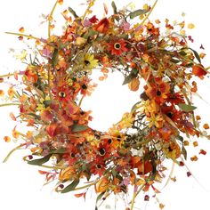 an orange and yellow wreath with flowers on it