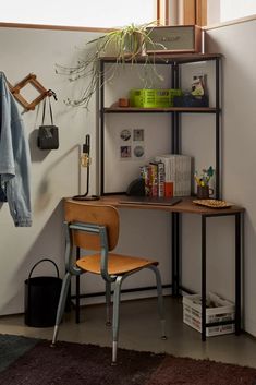 a room with a chair, desk and shelves