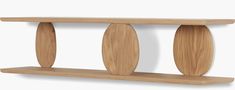 a wooden shelf with three circular sections on it's sides and two curved shelves below