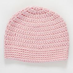 a pink crocheted hat on a white background