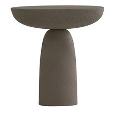 a concrete table with a circular base