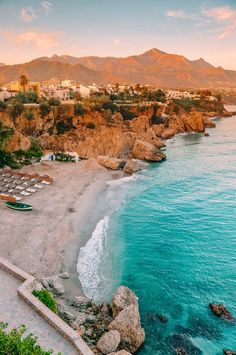 an aerial view of the beach and mountains in cabo san lucas, mexico at sunset