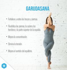 a woman is doing yoga in front of a white brick wall with the words garudosana