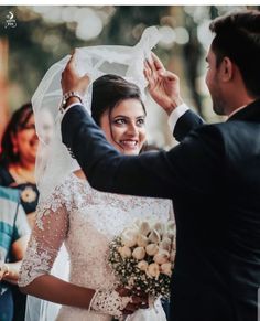 a bride and groom getting ready to walk down the aisle