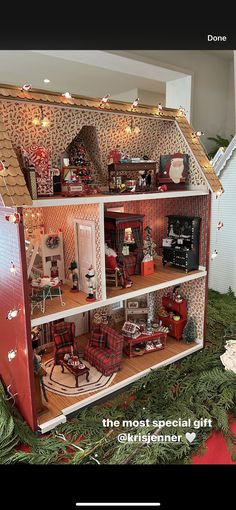 a doll house with furniture and decorations on the top floor is featured in this christmas ad