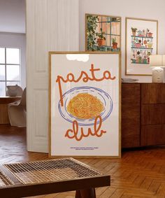 there is a poster on the wall in the room that says pasta dull and an empty table next to it