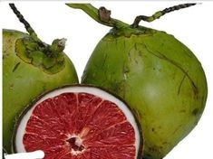 a grapefruit cut in half sitting next to another grapefruit on a white background