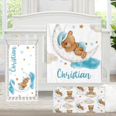 a baby crib bedding set with a teddy bear on the moon