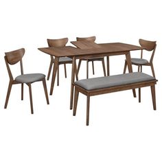 a dining table with four chairs and a bench