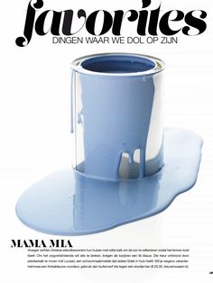 a magazine cover with an image of a blue cup on top of a white table