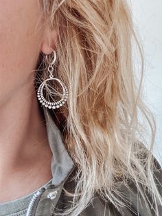 An elevated take on the classic hoop style, these boho chic earrings feature simple hoops embellished with dangling beaded metal pendants and post-back closures. ▪️Silver plated brass hoop - 16mm ▪️Silver plated brass pendant - 36mm x 33mm ▪️Total dangle - 60mm ▪️The earrings will come presented in a cotton gift bag 🔹 Please note that, unfortunately, returns cannot be accpeted on earrings for hygiene reasons 🔹 Sterling Silver Chandelier Earrings With Dangling Beads, Teardrop Chandelier Earrings For Festival, Bohemian Hoop Earrings With Ear Wire, Bohemian Hoop Earrings With Dangling Charms, Bohemian Beaded Hoop Earrings For Everyday, Bohemian Chandelier Earrings With Dangling Beads, Everyday Bohemian Beaded Hoop Earrings, Dangling Beads Round Earrings, Bohemian Earrings With Dangling Beads For Everyday