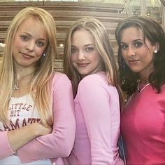 three young women standing next to each other