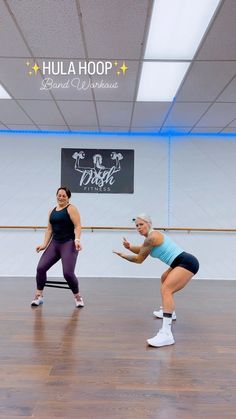 two women in a dance studio doing exercises