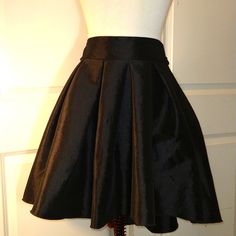 Black Taffeta Skirt By Vertiche Excellent Unused Condition Super Cute And Elegant. Ties Around The Waist Zipper In Back Full Skirt With Pleats. Hand Washable. S429i Black A-line Voluminous Skirt, Elegant A-line Mini Skirt For Evening, Flowy A-line Pleated Skirt For Party, Fitted Pleated Mini Skirt For Party, Evening Pleated Mini Skirt, Solid Color Mini Skirt For Party, Chic Formal Full Mini Skirt, Pleated A-line Mini Skirt For Night Out, Chic A-line Skirt For Party