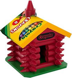 a crayon style house with the roof made out of red plastic cups and sticks